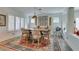 Charming dining room features a large wooden table, seating for eight, and plantation shutters at 7349 Royal Melbourne Dr, Las Vegas, NV 89131