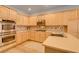 Modern kitchen with stainless steel appliances, custom cabinetry, and stylish countertops at 7349 Royal Melbourne Dr, Las Vegas, NV 89131