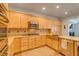 Well-equipped kitchen with stainless steel appliances and light wood cabinetry at 7349 Royal Melbourne Dr, Las Vegas, NV 89131