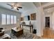 Bright living room featuring wood floors, plantation shutters, and a modern TV at 7349 Royal Melbourne Dr, Las Vegas, NV 89131
