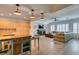 Open-concept living space with hardwood floors, recessed lighting, and modern furniture at 7349 Royal Melbourne Dr, Las Vegas, NV 89131