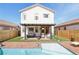Inviting backyard featuring a pool, patio with seating, and manicured landscaping perfect for outdoor gatherings at 7566 Hope Valley St, Las Vegas, NV 89139