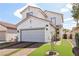 Charming two-story home with a well-manicured lawn, brick driveway and a two car garage at 7566 Hope Valley St, Las Vegas, NV 89139