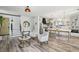 Inviting living room boasts an open floorplan, wood floors, modern decor, and seamless flow to the kitchen at 7566 Hope Valley St, Las Vegas, NV 89139
