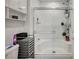 A bathroom with glass enclosed shower and shelves for storage at 759 Pickled Pepper Pl, Henderson, NV 89011