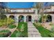 Charming two-story townhome featuring an inviting front porch with desert landscaping and a paved entryway at 759 Pickled Pepper Pl, Henderson, NV 89011
