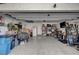 Spacious garage with ample storage, fitness equipment, and a refrigerator at 759 Pickled Pepper Pl, Henderson, NV 89011