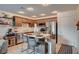 Modern kitchen featuring stainless steel appliances, a central island with bar seating, and stylish decor at 759 Pickled Pepper Pl, Henderson, NV 89011