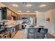 Stylish kitchen with stainless appliances, a central island with seating, and ample cabinet space at 759 Pickled Pepper Pl, Henderson, NV 89011