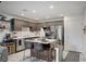 Modern kitchen featuring stainless steel appliances, an island with seating, and stylish decor at 759 Pickled Pepper Pl, Henderson, NV 89011