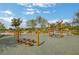 Community playground featuring wooden climbing features, rope bridge, and mushroom stools at 759 Pickled Pepper Pl, Henderson, NV 89011