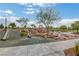 Community playground with slides and rock climbing under a cloudy blue sky at 759 Pickled Pepper Pl, Henderson, NV 89011