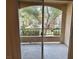 A balcony with a view of lush greenery and community landscape at 7885 W Flamingo Rd # 1064, Las Vegas, NV 89147