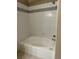 This bathroom features a shower over a soaking tub with tile walls at 7885 W Flamingo Rd # 1064, Las Vegas, NV 89147
