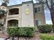 The exterior of this two-story condo shows balconies, landscaping, and windows at 7885 W Flamingo Rd # 1064, Las Vegas, NV 89147