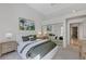 Bright bedroom with white walls, stylish decor, and a closet with mirrored doors at 8121 Castle Pines Ave, Las Vegas, NV 89113