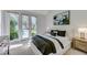 Well-lit bedroom with French doors leading to the backyard and swimming pool at 8121 Castle Pines Ave, Las Vegas, NV 89113