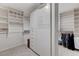 Well-organized walk-in closet with custom shelving, drawers, and hanging space for clothes and accessories at 8121 Castle Pines Ave, Las Vegas, NV 89113
