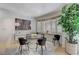 Bright dining room with modern glass table and comfortable upholstered chairs at 8121 Castle Pines Ave, Las Vegas, NV 89113