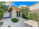 A landscaped front entrance leads to the doors of this beautiful home at 8121 Castle Pines Ave, Las Vegas, NV 89113