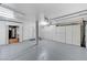 Oversized three car garage with built in cabinets and additional storage space at 8121 Castle Pines Ave, Las Vegas, NV 89113