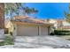 This beautiful home has a spacious two-car garage and manicured landscaping at 8121 Castle Pines Ave, Las Vegas, NV 89113