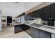 Modern kitchen with sleek countertops, ample cabinet space, and contemporary appliances at 8121 Castle Pines Ave, Las Vegas, NV 89113