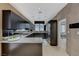 Modern kitchen featuring sleek cabinets, stainless steel appliances, and an open design at 8121 Castle Pines Ave, Las Vegas, NV 89113