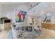 Bright and airy living room with vaulted ceiling, modern decor, and eye-catching artwork at 8121 Castle Pines Ave, Las Vegas, NV 89113