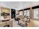 Inviting living room with fireplace, comfortable seating, and lots of natural light at 8121 Castle Pines Ave, Las Vegas, NV 89113