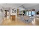 Spacious living room with hardwood floors, modern decor, and pool view at 8121 Castle Pines Ave, Las Vegas, NV 89113