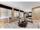 Comfortable living room featuring contemporary decor, large windows, and stylish furniture at 8121 Castle Pines Ave, Las Vegas, NV 89113