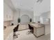 Office space with two built-in desks, shelving units, and ample overhead lighting at 8121 Castle Pines Ave, Las Vegas, NV 89113