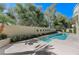 Beautiful backyard swimming pool and spa surrounded by a private wall and mature landscaping at 8121 Castle Pines Ave, Las Vegas, NV 89113