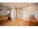 Cozy bonus room area showcasing wood floors with easy access to the laundry room at 8368 Creek Canyon Ave, Las Vegas, NV 89113