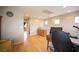 Bright bonus room with wood floors, desk space, and natural light from upper windows at 8368 Creek Canyon Ave, Las Vegas, NV 89113