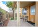 Inviting covered patio with seating, providing a relaxing outdoor living space in the backyard at 8368 Creek Canyon Ave, Las Vegas, NV 89113