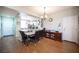 Cozy dining area open to kitchen, ideal for Gathering meals and entertaining, features modern lighting at 8368 Creek Canyon Ave, Las Vegas, NV 89113