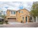 Inviting two-story home showcasing neutral stucco and a convenient attached two-car garage at 8368 Creek Canyon Ave, Las Vegas, NV 89113