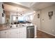 Modern kitchen with stainless steel sink and dishwasher, open to the living area at 8368 Creek Canyon Ave, Las Vegas, NV 89113
