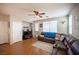 Comfortable living room with wood flooring and a large, cozy leather sectional at 8368 Creek Canyon Ave, Las Vegas, NV 89113