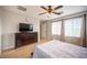 Spacious main bedroom featuring lots of natural light from the large window and a large dresser at 8368 Creek Canyon Ave, Las Vegas, NV 89113