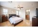 Spacious primary bedroom boasting light wood floors and an en suite bathroom entrance at 8368 Creek Canyon Ave, Las Vegas, NV 89113