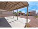 Spacious back patio features a covered area and low-maintenance landscaping with decorative rock, providing an outdoor space at 8725 Russet Hills Ct, Las Vegas, NV 89147