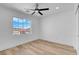Bright, vacant bedroom with a large window overlooking the neighborhood at 8725 Russet Hills Ct, Las Vegas, NV 89147