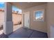 Covered front porch area with view of front door and small window at 8725 Russet Hills Ct, Las Vegas, NV 89147