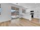 Bright kitchen featuring white cabinets, a breakfast bar, and sliding doors to the backyard at 8725 Russet Hills Ct, Las Vegas, NV 89147