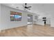 Open-concept living room with sleek flooring and a large window offering abundant natural light at 8725 Russet Hills Ct, Las Vegas, NV 89147