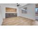 Inviting living room featuring sleek floors, a stylish fireplace, and lots of natural light at 8725 Russet Hills Ct, Las Vegas, NV 89147