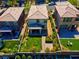 Aerial backyard view shows green grass, patio and garden at 880 Cirrus Cloud Ave, Las Vegas, NV 89138